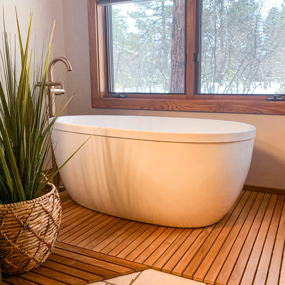Blue Ridge bathroom after remodel — freestanding soaking tub on teak flooring